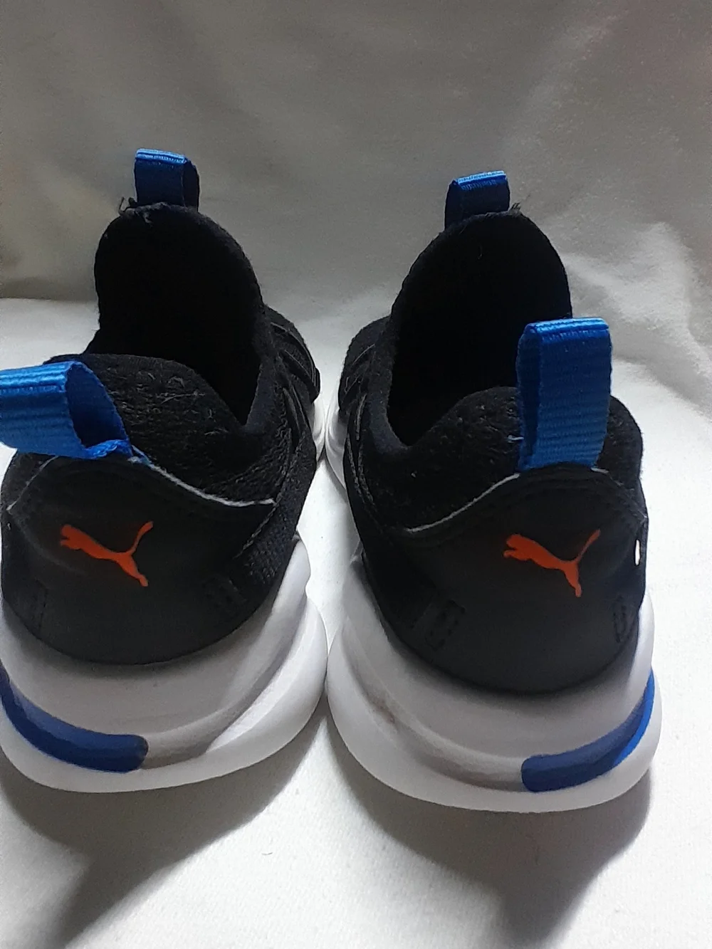 Puma Kids Black Sneakers with Orange Logo and Blue Accents